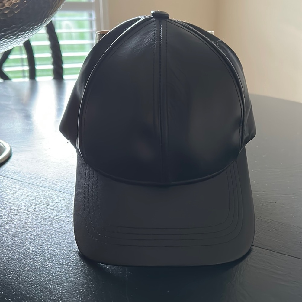 Black genuine leather baseball cap.